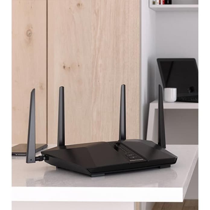 Netgear RAX43 AX4200 Wi‑Fi 6 router with external antennas and gigabit Ethernet ports